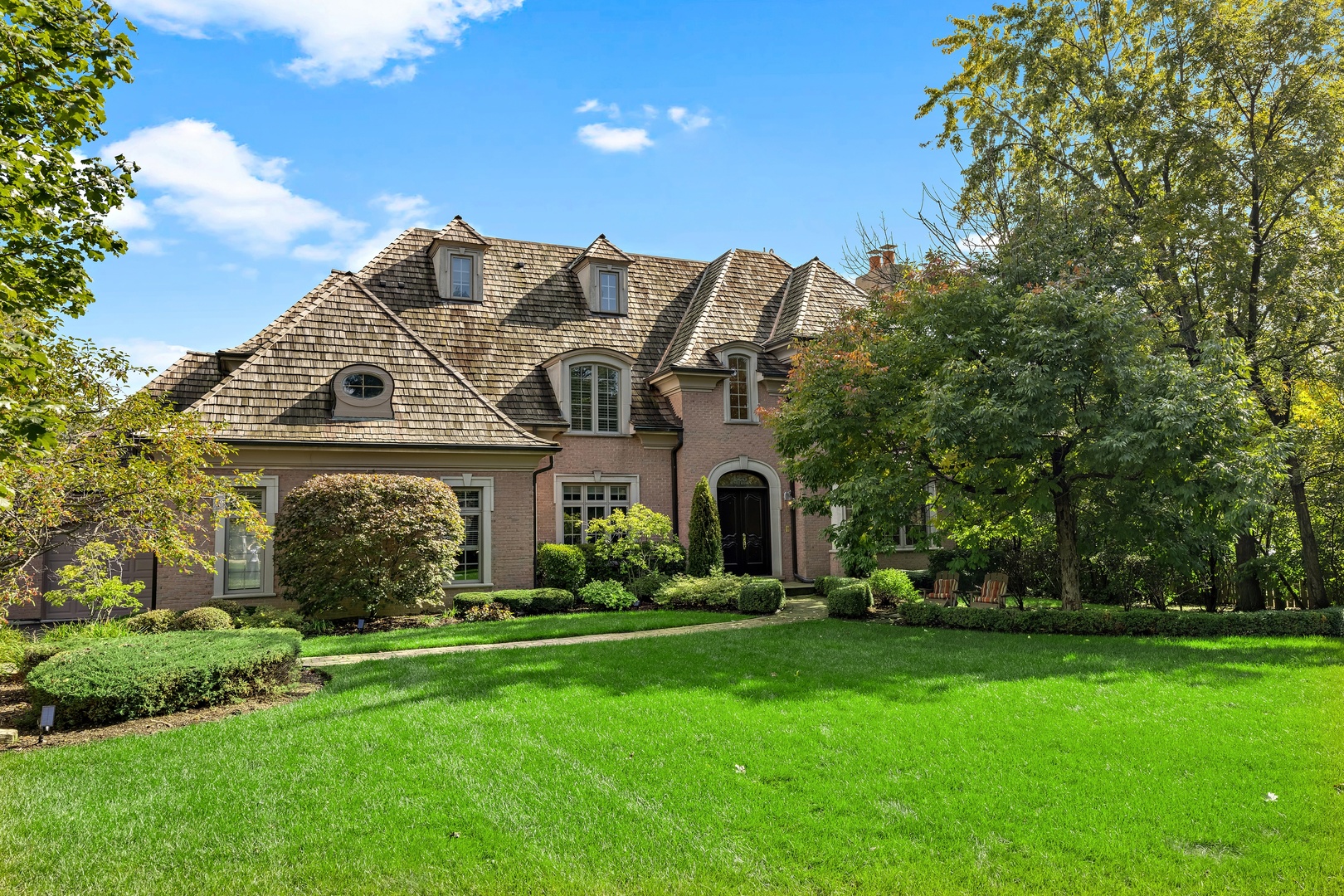 425 Sunset Ridge Road Northfield, IL 60093 - Photo 1 of 53 a front view of house with yard and green space