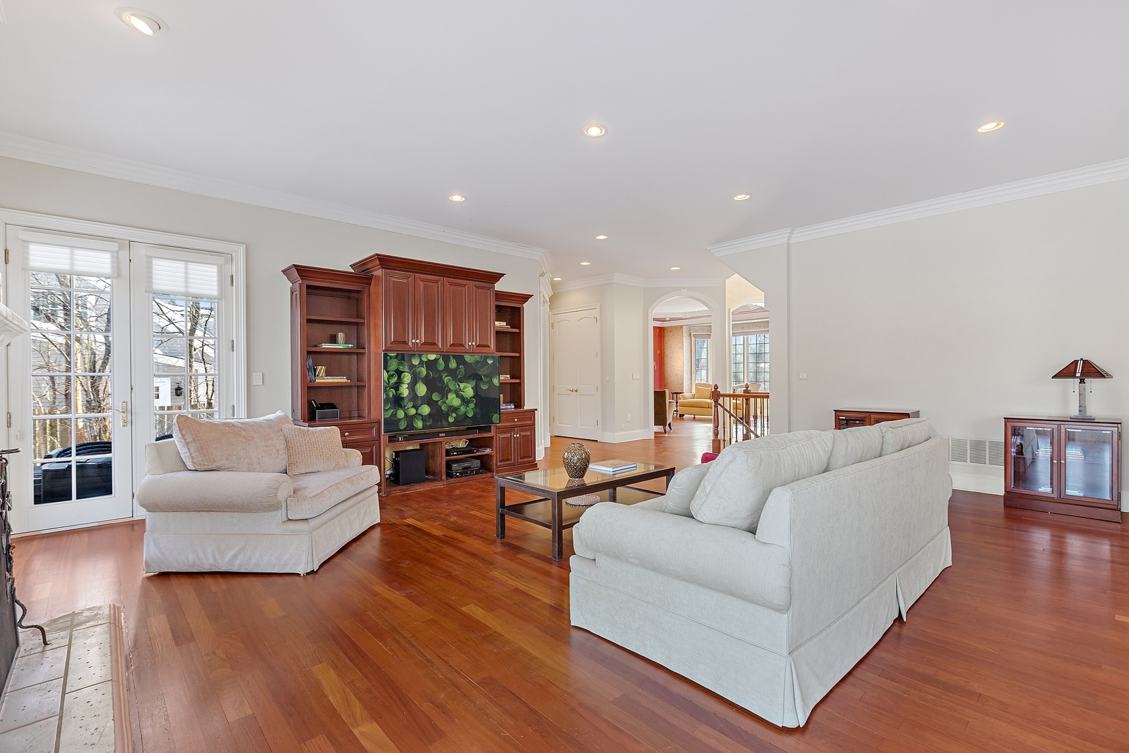 425 Sunset Ridge Road Northfield, IL 60093 - Photo 12 of 53 a living room with furniture and a large mirror with wooden floor