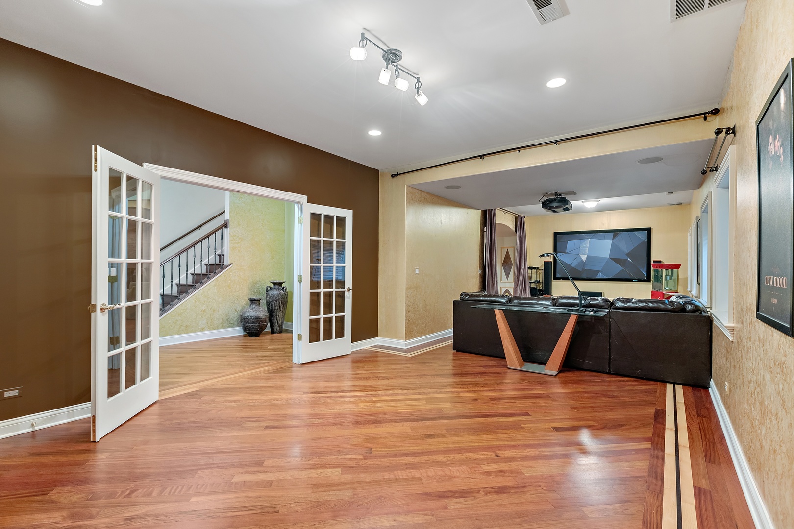 425 Sunset Ridge Road Northfield, IL 60093 - Photo 23 of 53 a view of a living room a dining room with wooden floor and furniture
