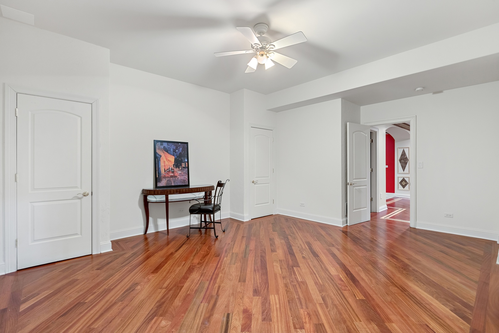 425 Sunset Ridge Road Northfield, IL 60093 - Photo 26 of 53 a view of a livingroom with wooden floor and a ceiling fan