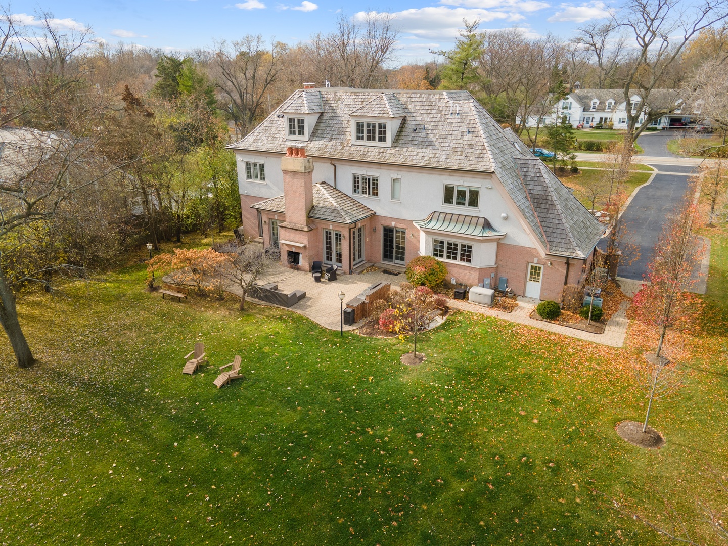 425 Sunset Ridge Road Northfield, IL 60093 - Photo 33 of 53 a view of a big house with a big yard and large trees