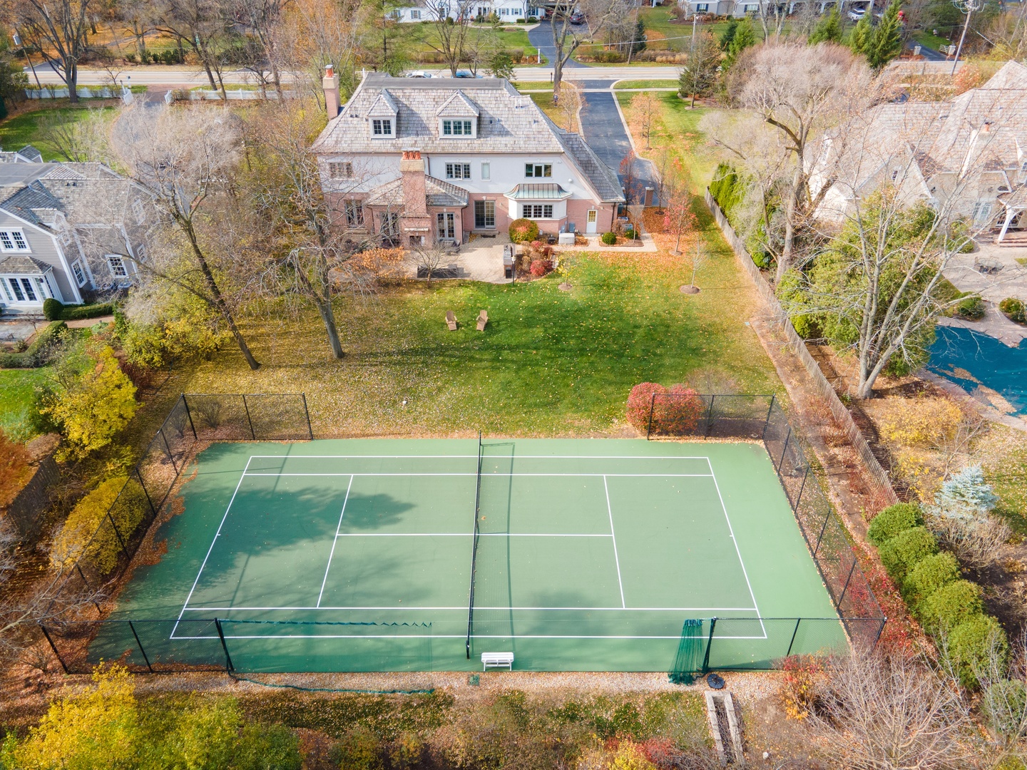 425 Sunset Ridge Road Northfield, IL 60093 - Photo 35 of 53 a view of a tennis ground with large trees