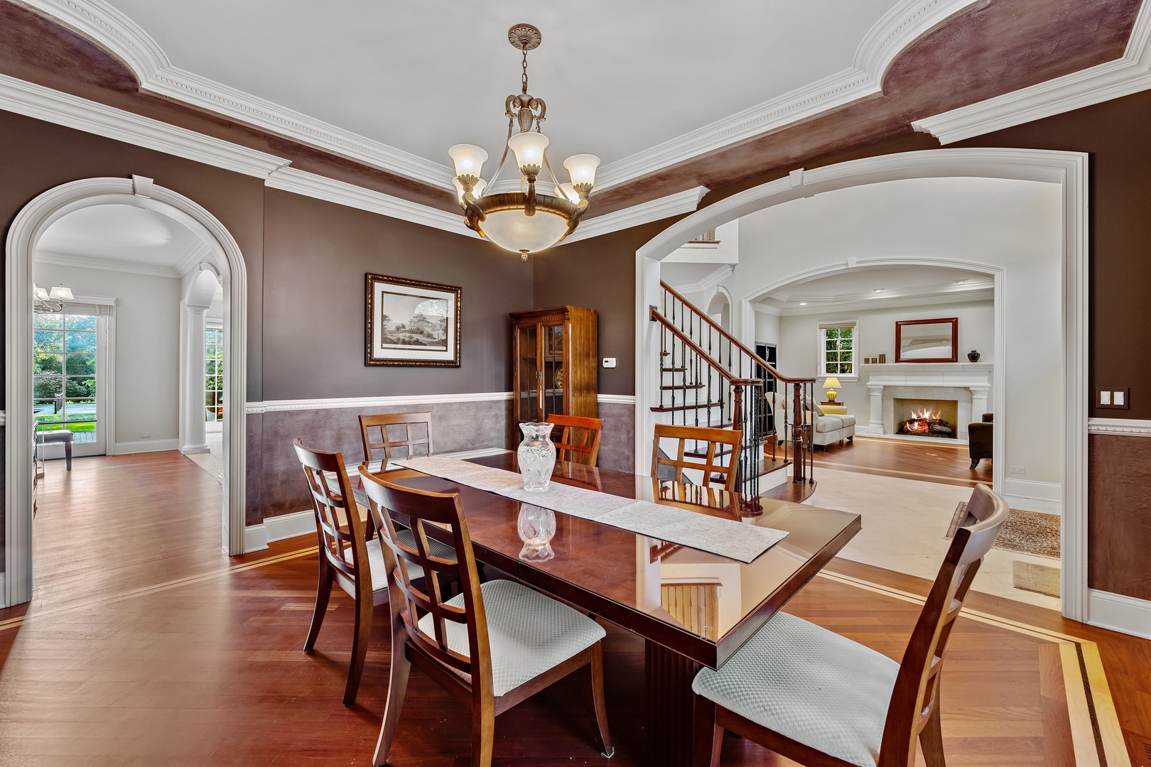 425 Sunset Ridge Road Northfield, IL 60093 - Photo 5 of 53 a view of a dining room with furniture a chandelier and wooden floor