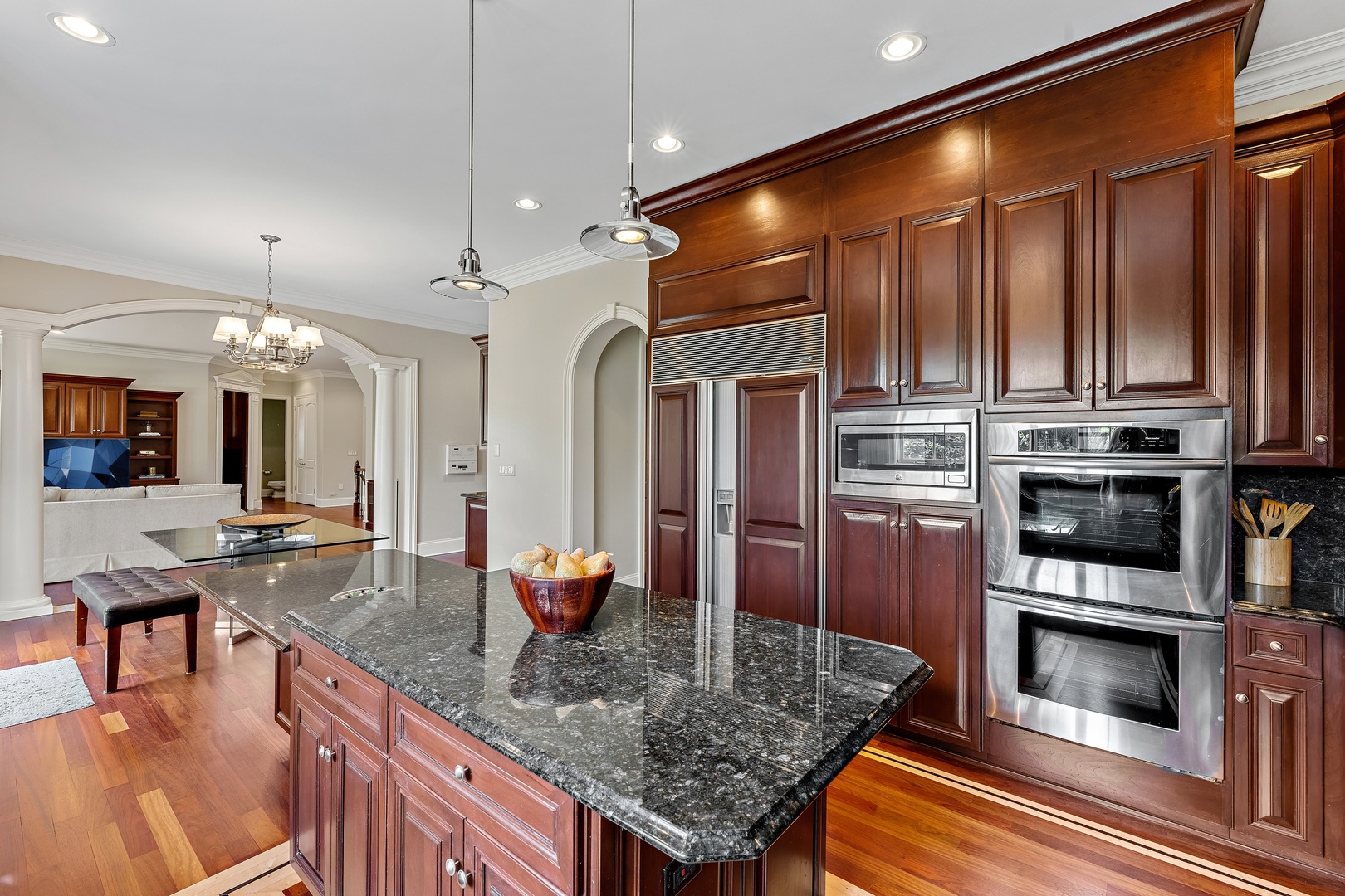 425 Sunset Ridge Road Northfield, IL 60093 - Photo 6 of 53 a kitchen with stainless steel appliances granite countertop a stove refrigerator and cabinets