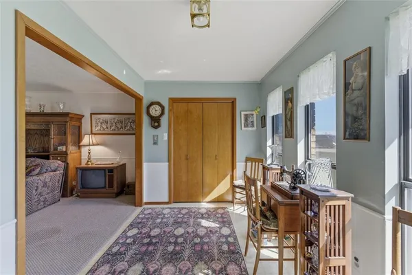 a bedroom with furniture and a window