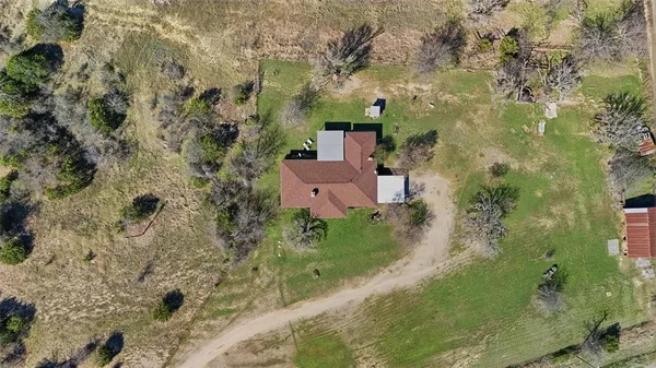 an aerial view of a house with a garden