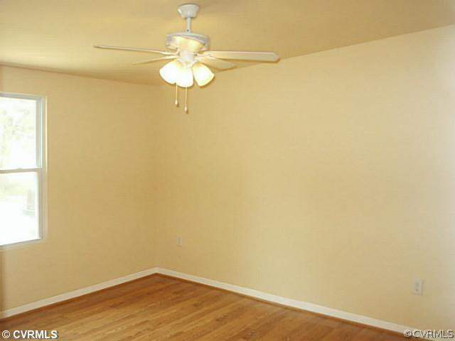 168 Dusty Road Bumpass, VA 23024 - Photo 6 of 6 a view of a room with wooden floor and a window
