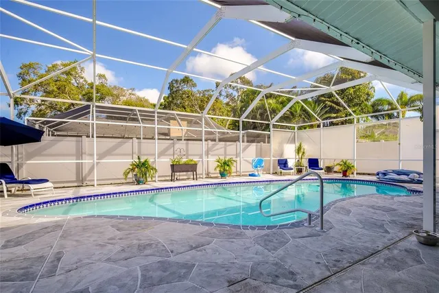 a view of a backyard with table and chairs