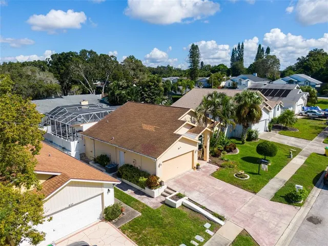 an aerial view of a house with a garden