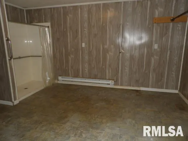 a view of an empty room with a wooden door