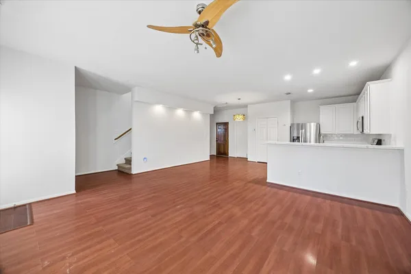a view of kitchen with sink microwave and stove