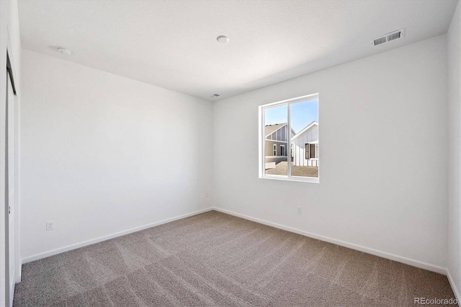 2870 Taryn Street Erie, CO 80026 - Photo 13 of 21 an empty room with a window