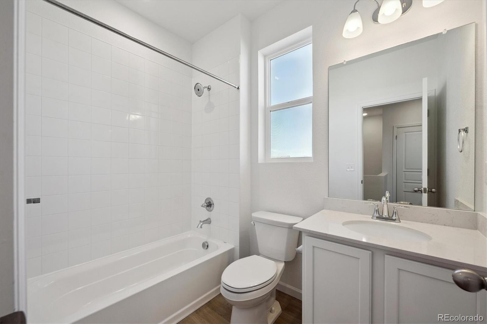 2870 Taryn Street Erie, CO 80026 - Photo 14 of 21 a bathroom with a sink toilet and shower