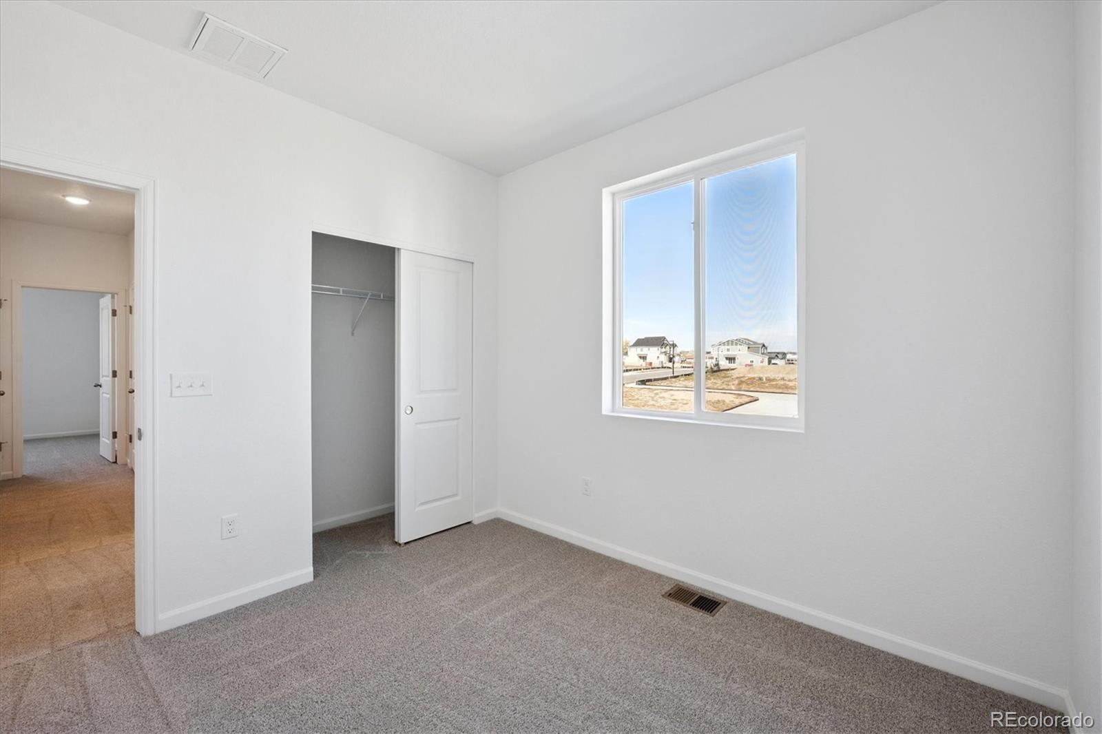 2870 Taryn Street Erie, CO 80026 - Photo 15 of 21 an empty room with windows and closet