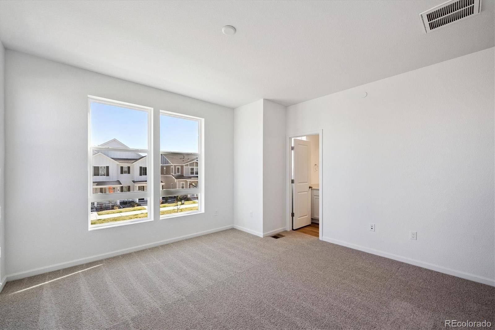 2870 Taryn Street Erie, CO 80026 - Photo 17 of 21 a view of an empty room with a window