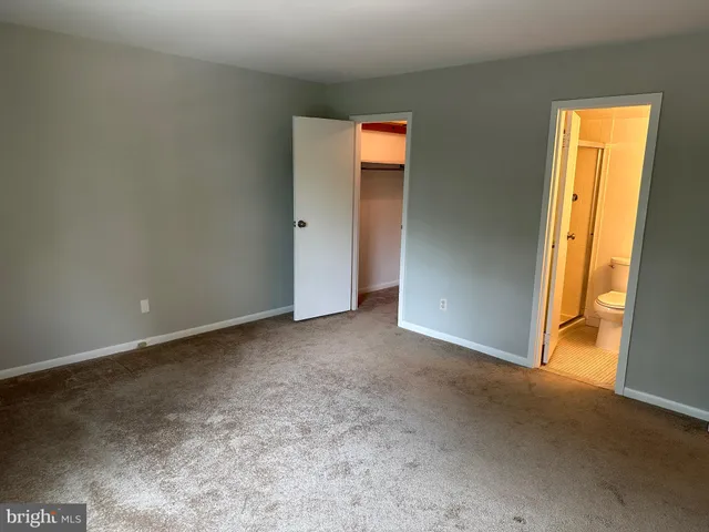 a bathroom with a sink toilet and mirror