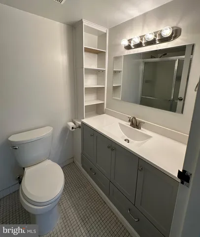 a bathroom with a glass shower door