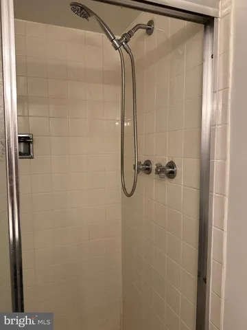 a front view of a house with barbeque and wooden floor