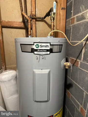 a sign broad in front of the red brick house