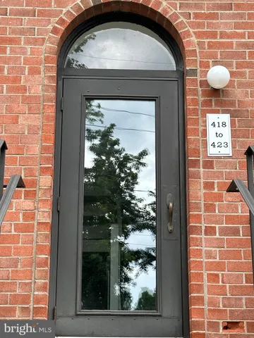 a view of a pathway with a yard