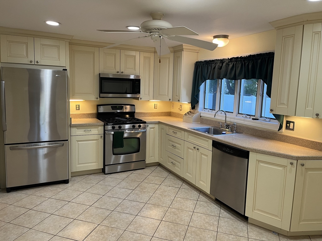 21 Grove Street Saugus, MA 01906 - Photo 2 of 10 a kitchen with a sink appliances and cabinets