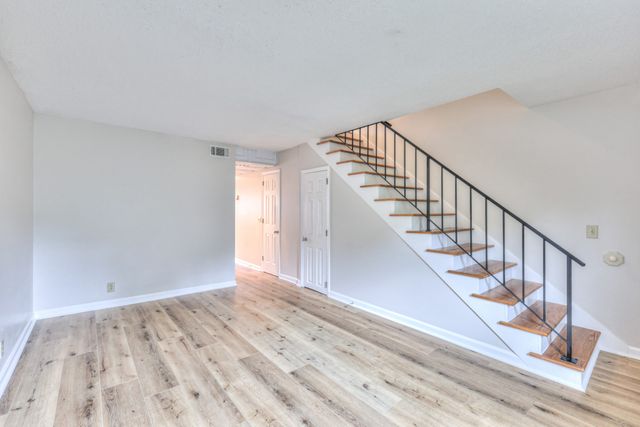 a view of entryway with wooden floor