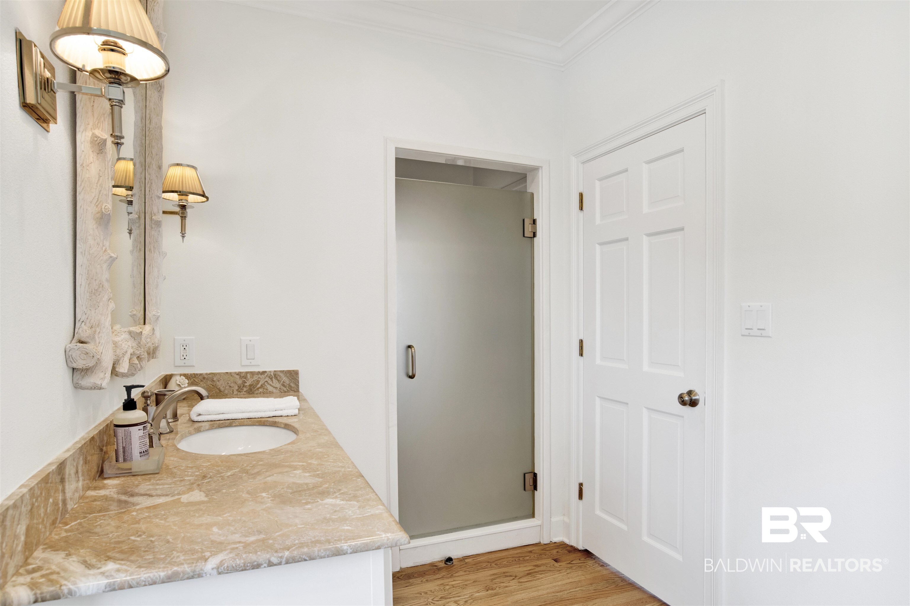 33400 River Road Orange Beach, AL 36561 - Photo 41 of 72 Bathroom featuring hardwood / wood-style flooring, dual vanity, ornamental molding, and an enclosed shower