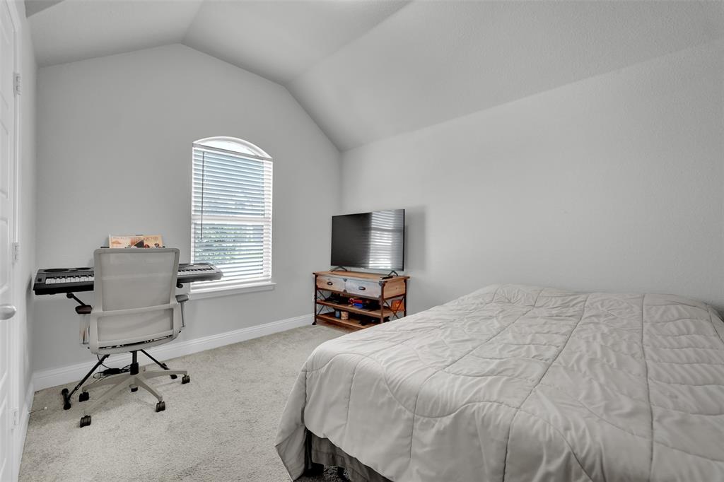 1340 Collett Sublett Road Kennedale, TX 76060 - Photo 24 of 25 Room featuring a vaulted ceiling, light gray walls, and light gray carpeting