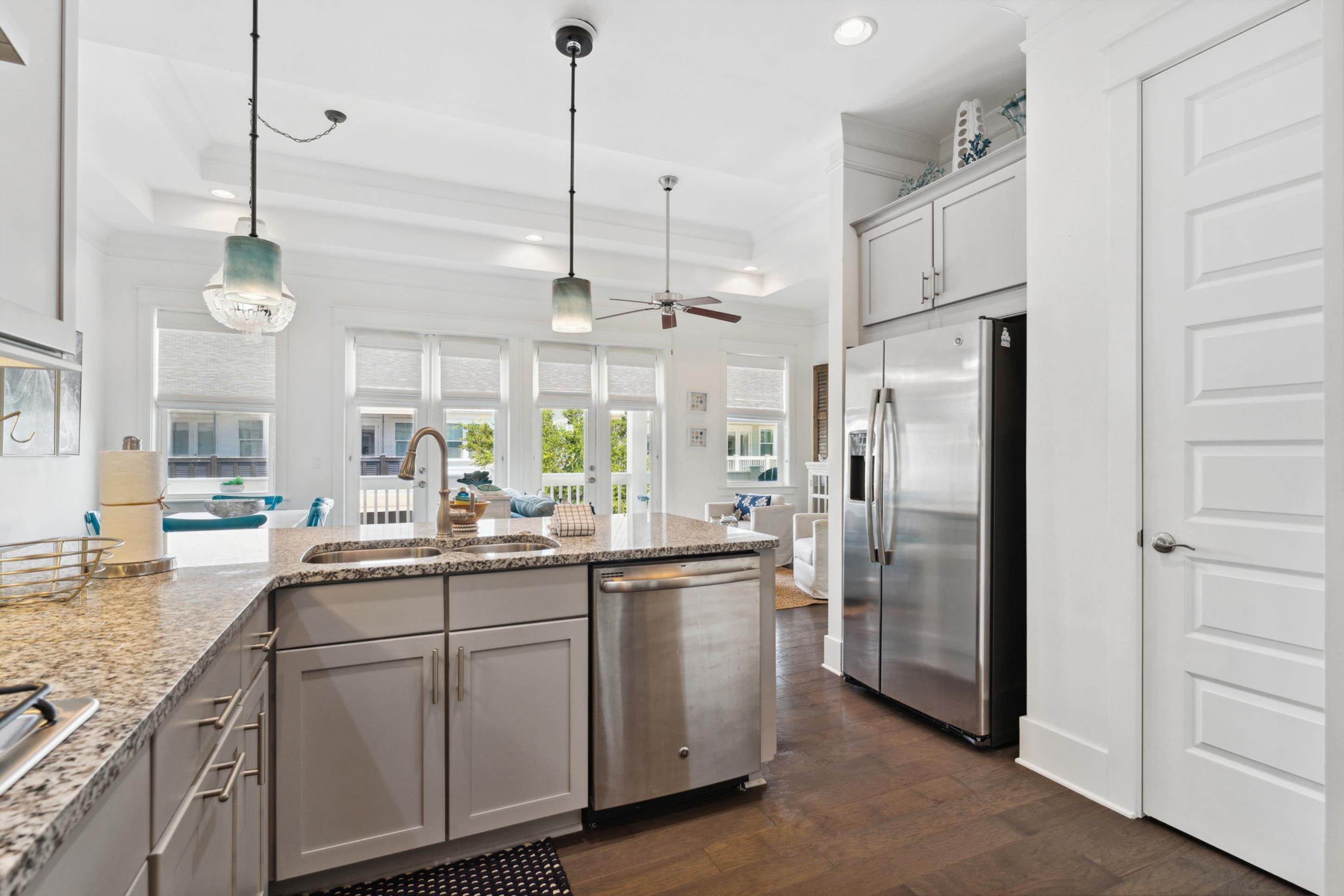 57 Milestone Dr Inlet Beach, Unit C Inlet Beach, FL 32461 - Photo 14 of 35 a kitchen with appliances a sink and cabinets