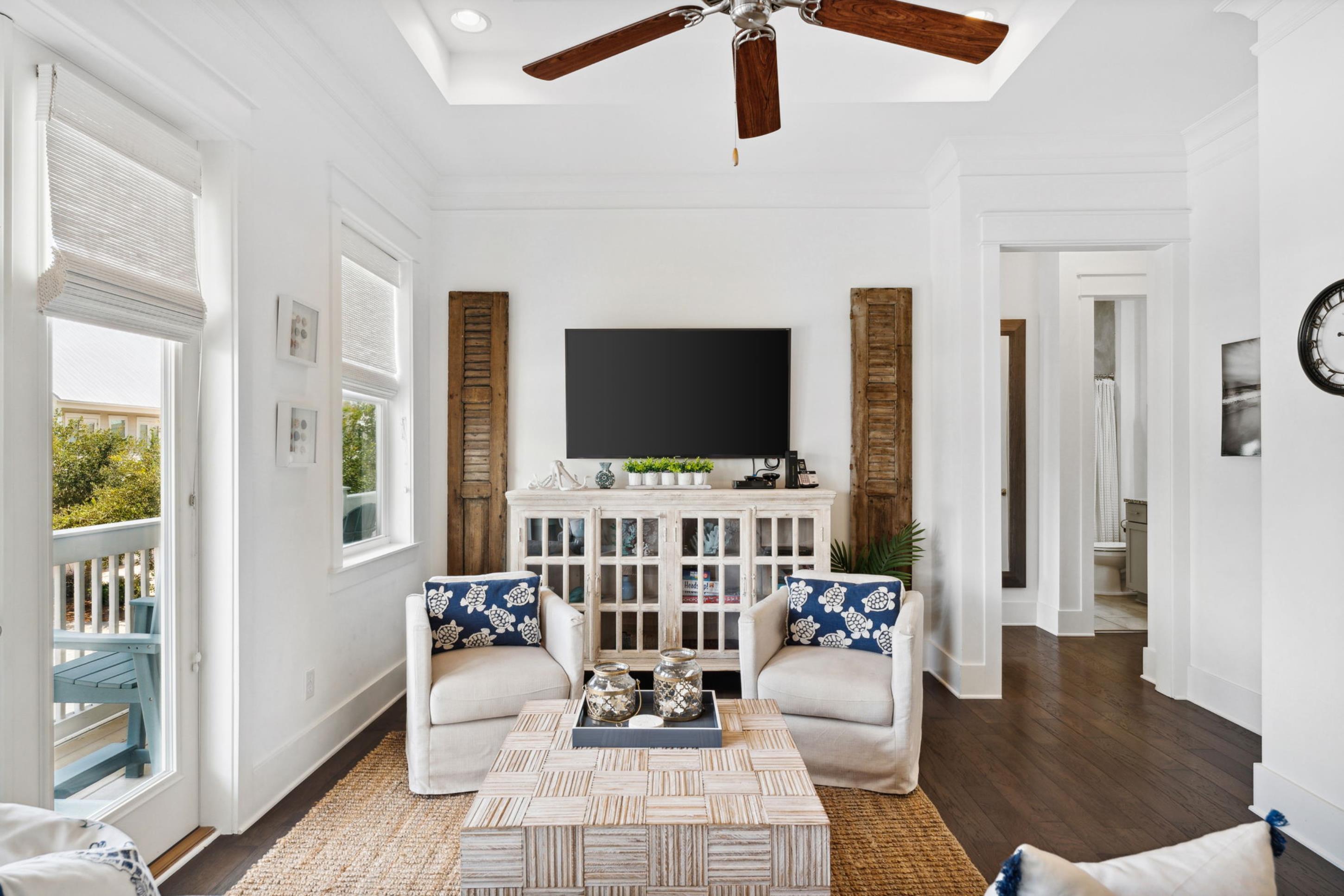 57 Milestone Dr Inlet Beach, Unit C Inlet Beach, FL 32461 - Photo 16 of 35 a living room with furniture and a flat screen tv
