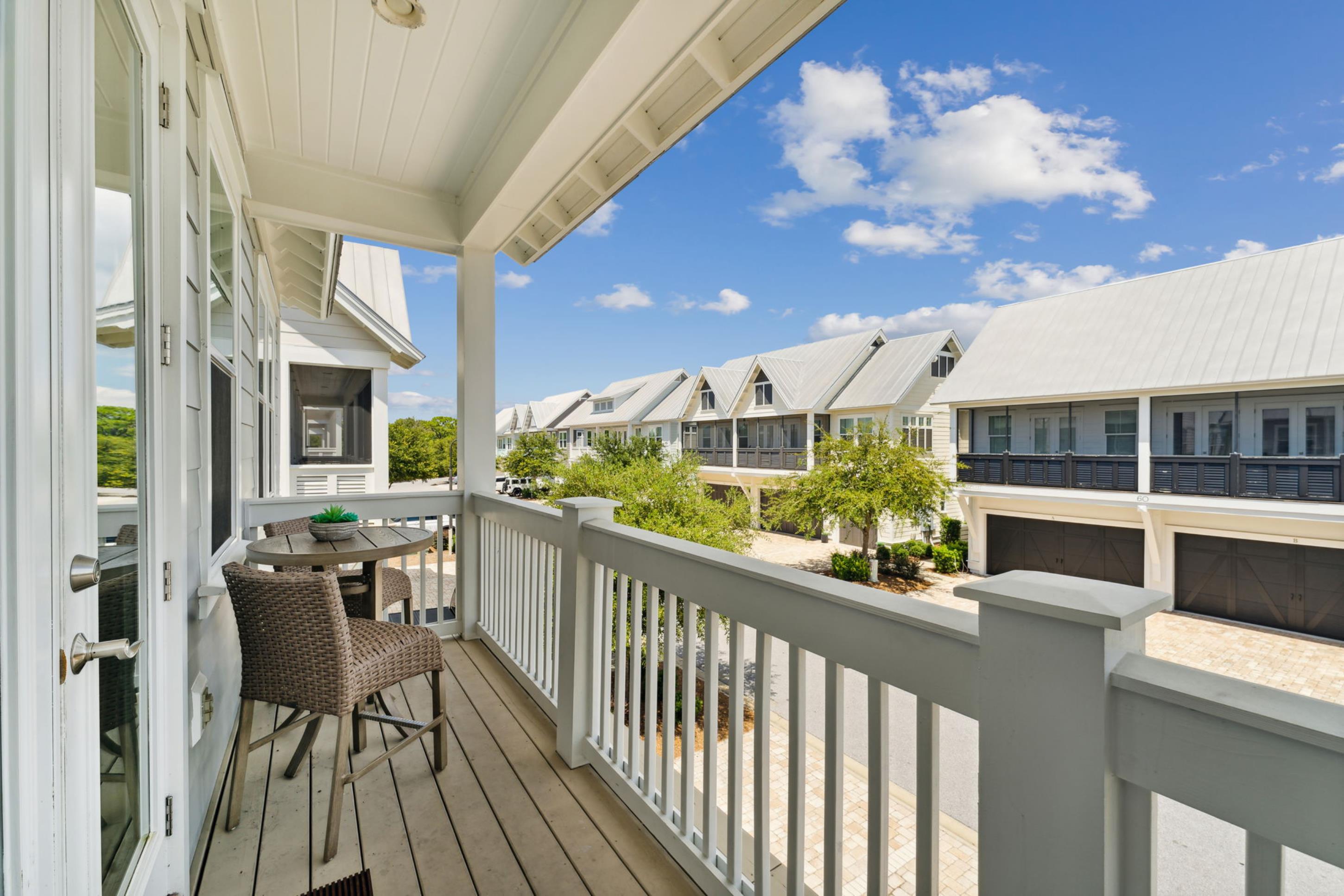 57 Milestone Dr Inlet Beach, Unit C Inlet Beach, FL 32461 - Photo 25 of 35 a view of a balcony with chairs