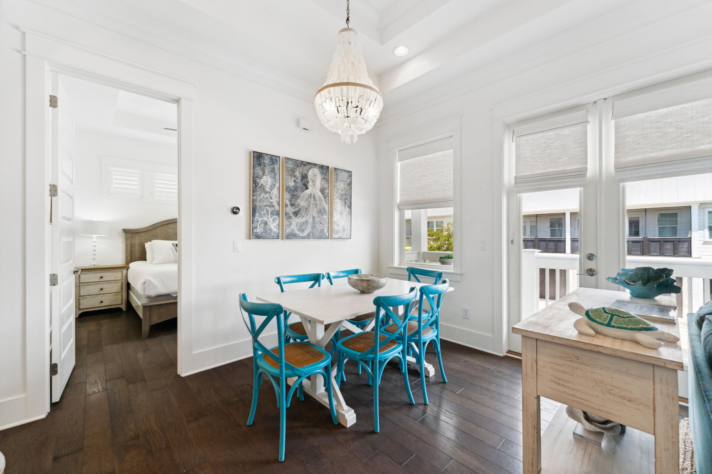 57 Milestone Dr Inlet Beach, Unit C Inlet Beach, FL 32461 - Photo 5 of 35 a view of a dining room with furniture and wooden floor