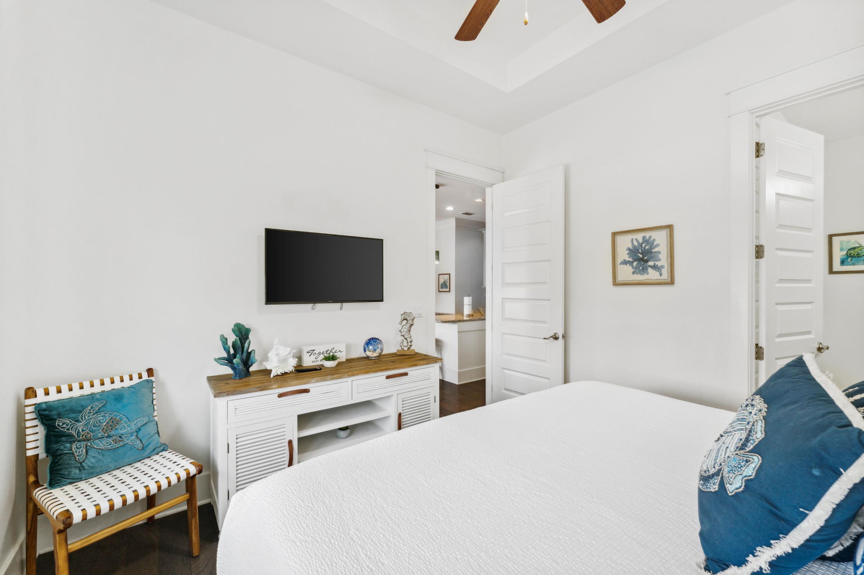 57 Milestone Dr Inlet Beach, Unit C Inlet Beach, FL 32461 - Photo 8 of 35 a bedroom with a bed and a flat screen tv