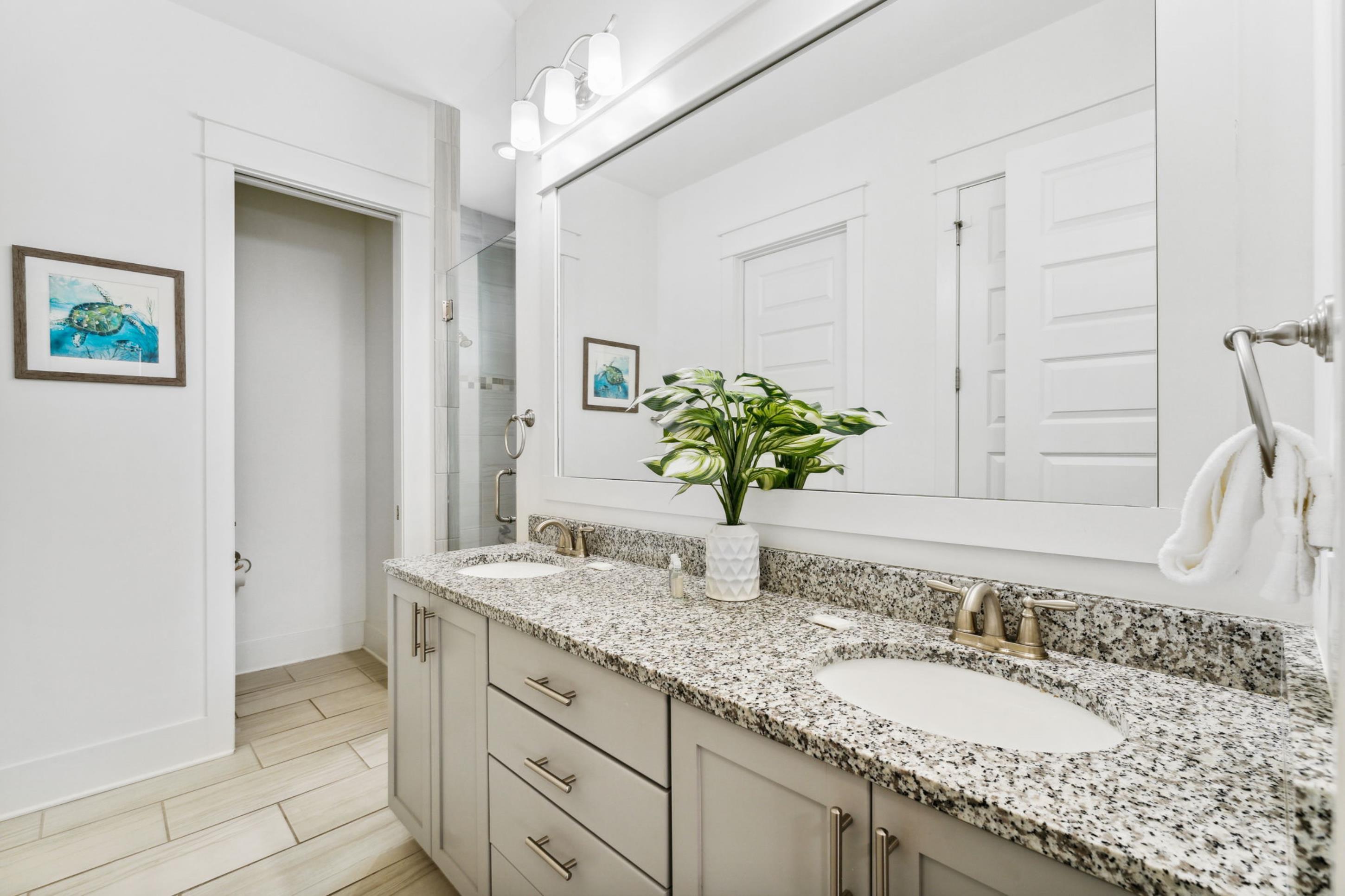 57 Milestone Dr Inlet Beach, Unit C Inlet Beach, FL 32461 - Photo 9 of 35 a bathroom with a granite countertop sink and a mirror