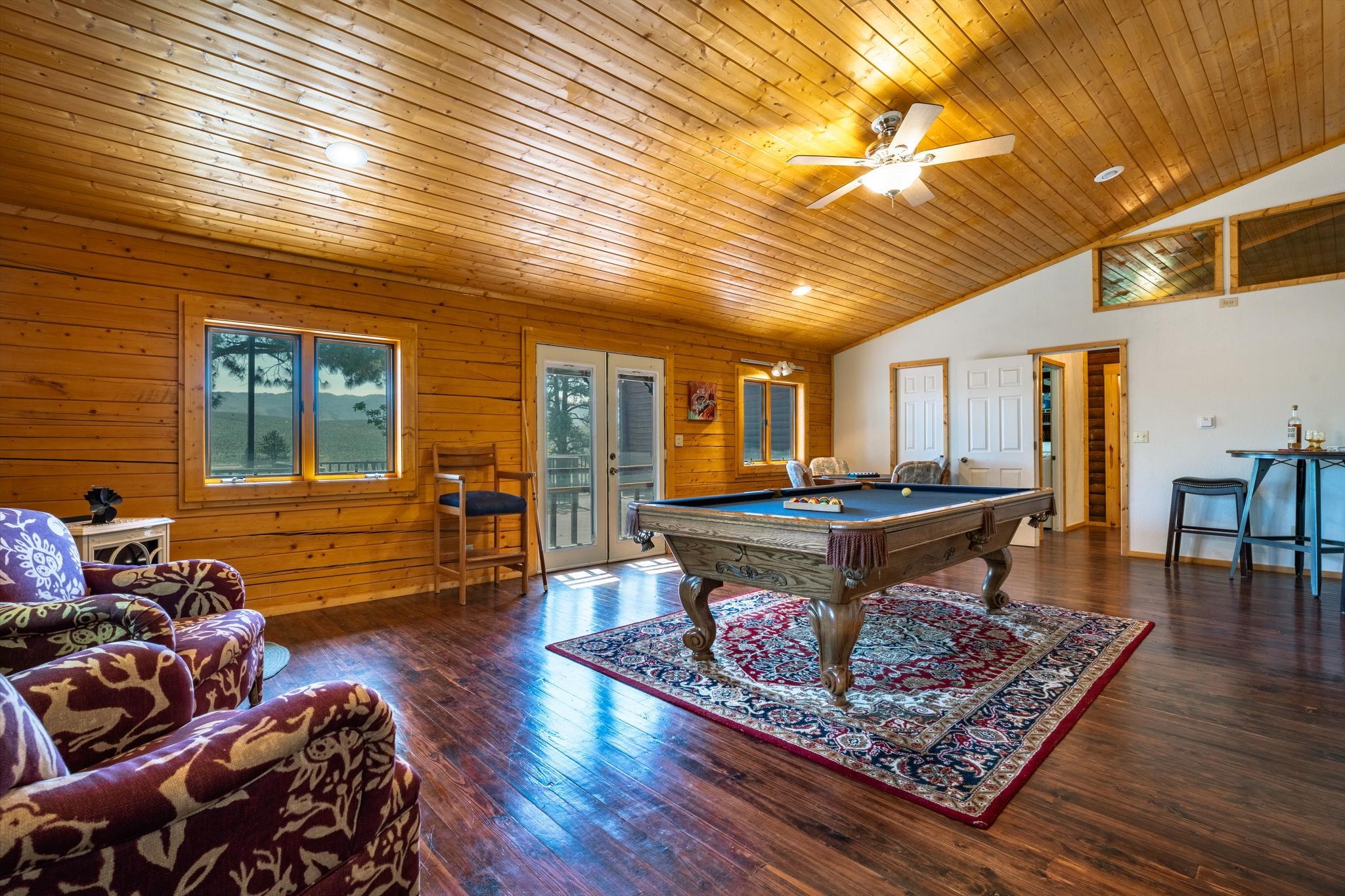 413-915 Scott Road Doyle, CA 96109 - Photo 15 of 28 a living room with furniture a wooden floor and next to a window