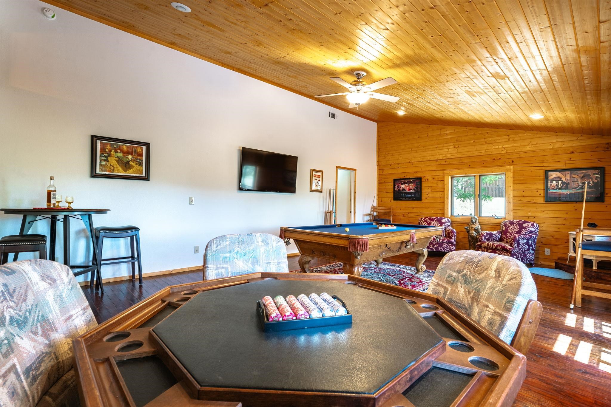 413-915 Scott Road Doyle, CA 96109 - Photo 16 of 28 a living room with furniture and a flat screen tv