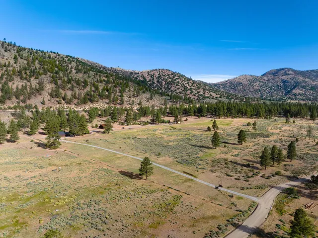a view of a yard with an ocean view
