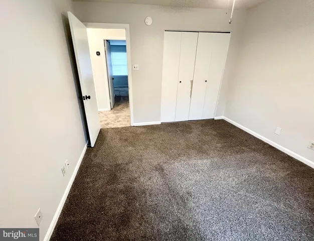 a view of empty room with windows