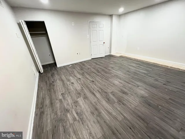 a view of a backyard with wooden fence