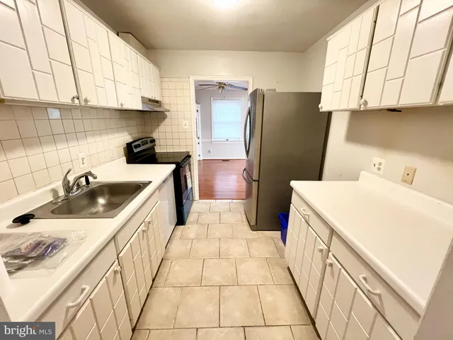 view of kitchen with sink and refrigerator