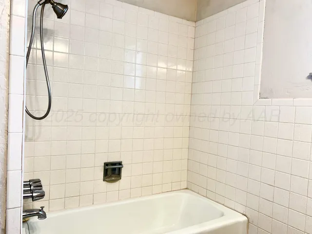 a bathroom with a bath tub