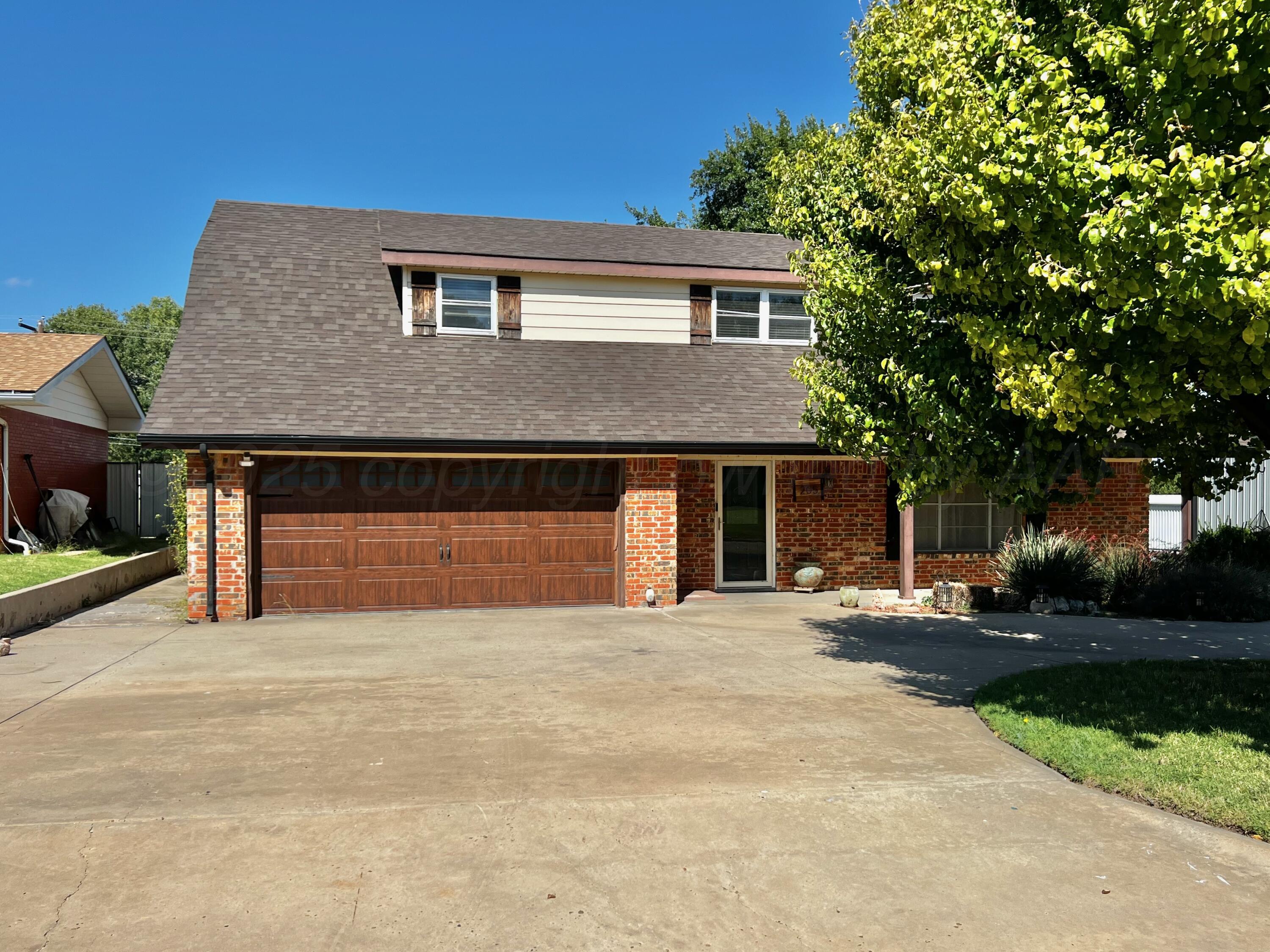 205 Houston Street Borger, TX 79007 - Photo 2 of 25 a front view of a house with a yard