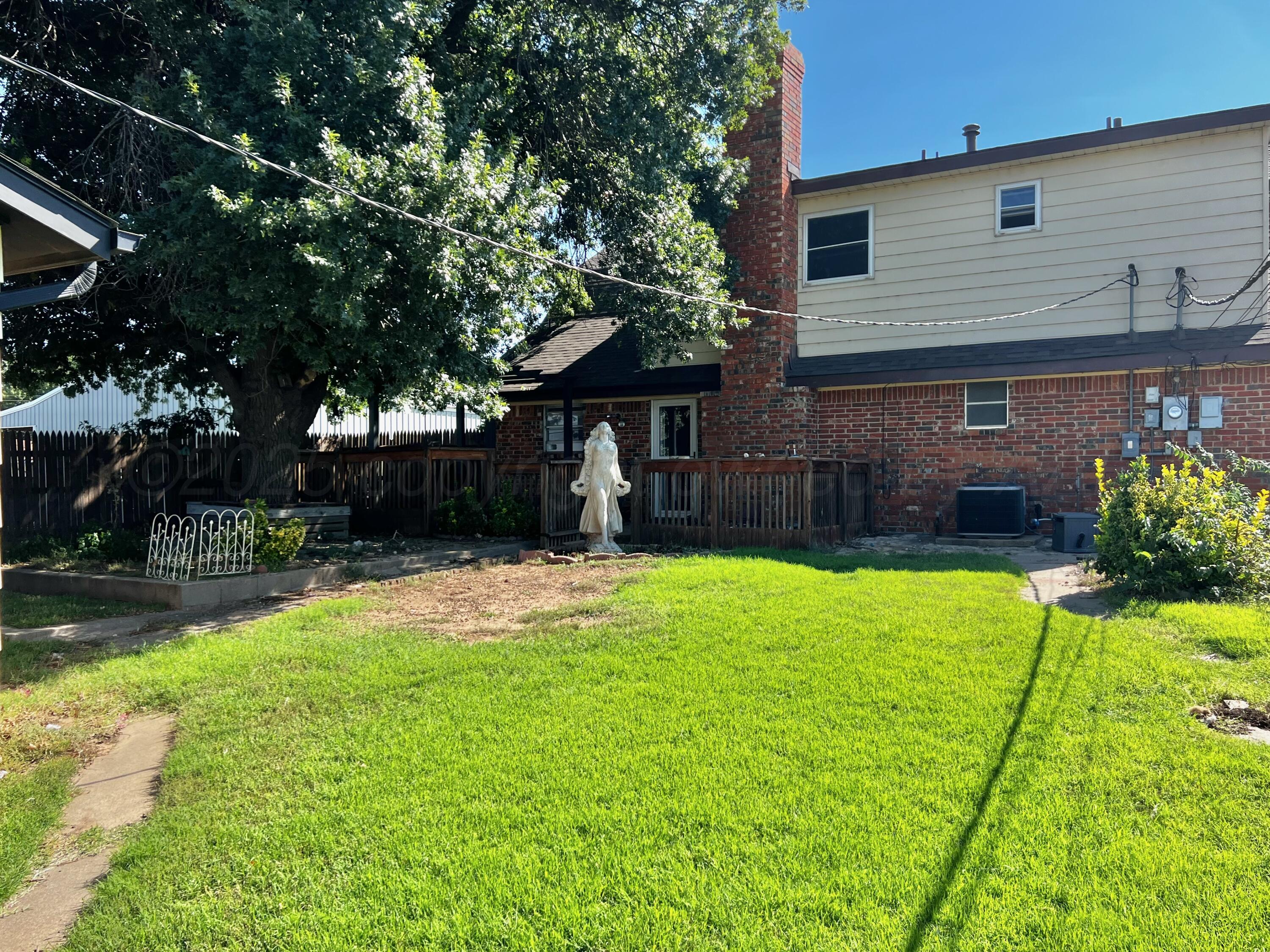 205 Houston Street Borger, TX 79007 - Photo 21 of 25 a front view of a house with a yard