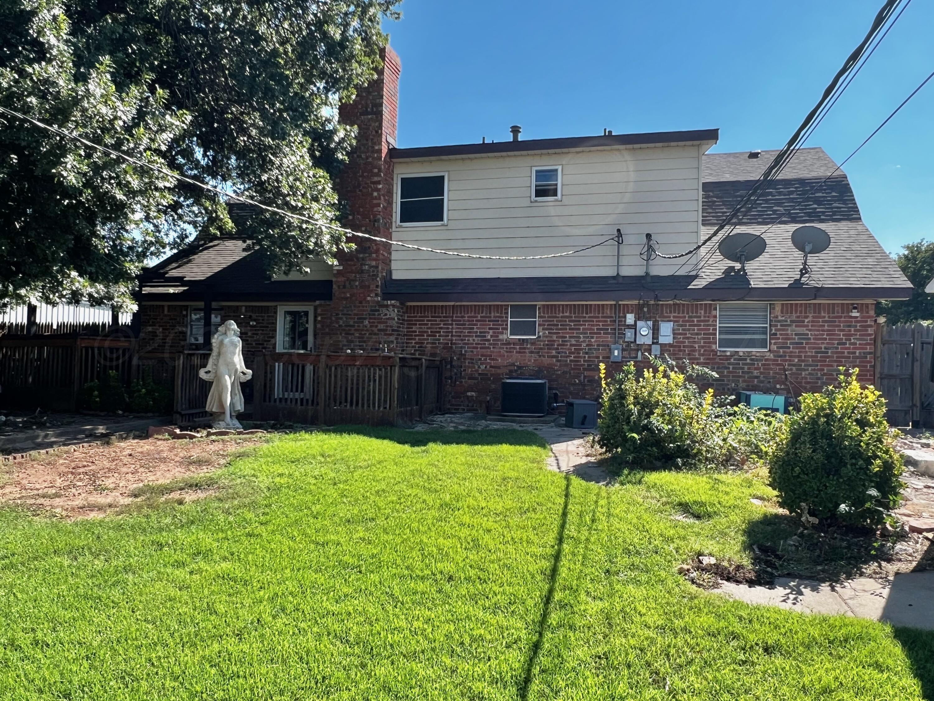 205 Houston Street Borger, TX 79007 - Photo 22 of 25 a front view of a house with a yard