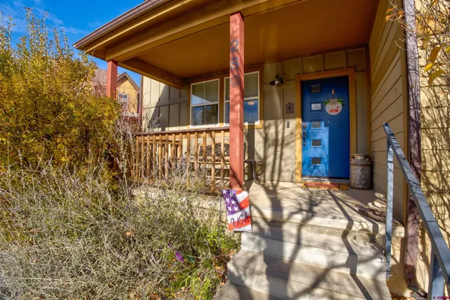 a view of a house with a small garden