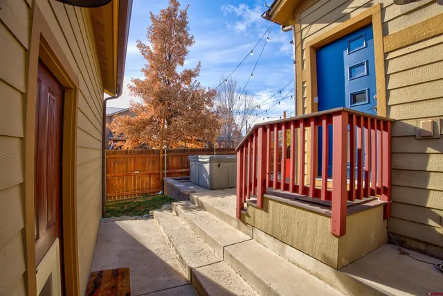 a view of a backyard with sitting area
