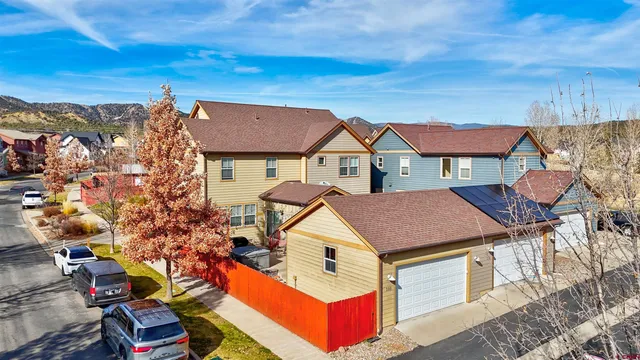 a aerial view of a house with a yard