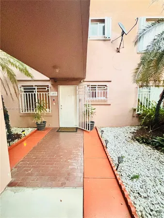 a front view of a house with trees