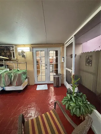 a view of a living room and entryway