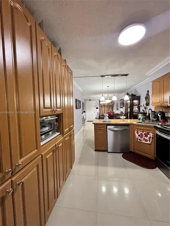 a kitchen with stainless steel appliances lots of counter top space